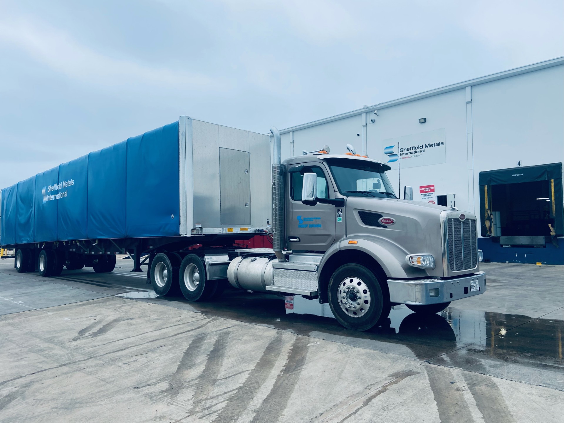 Sheffield Metals delivery truck carrying coil to a customer location