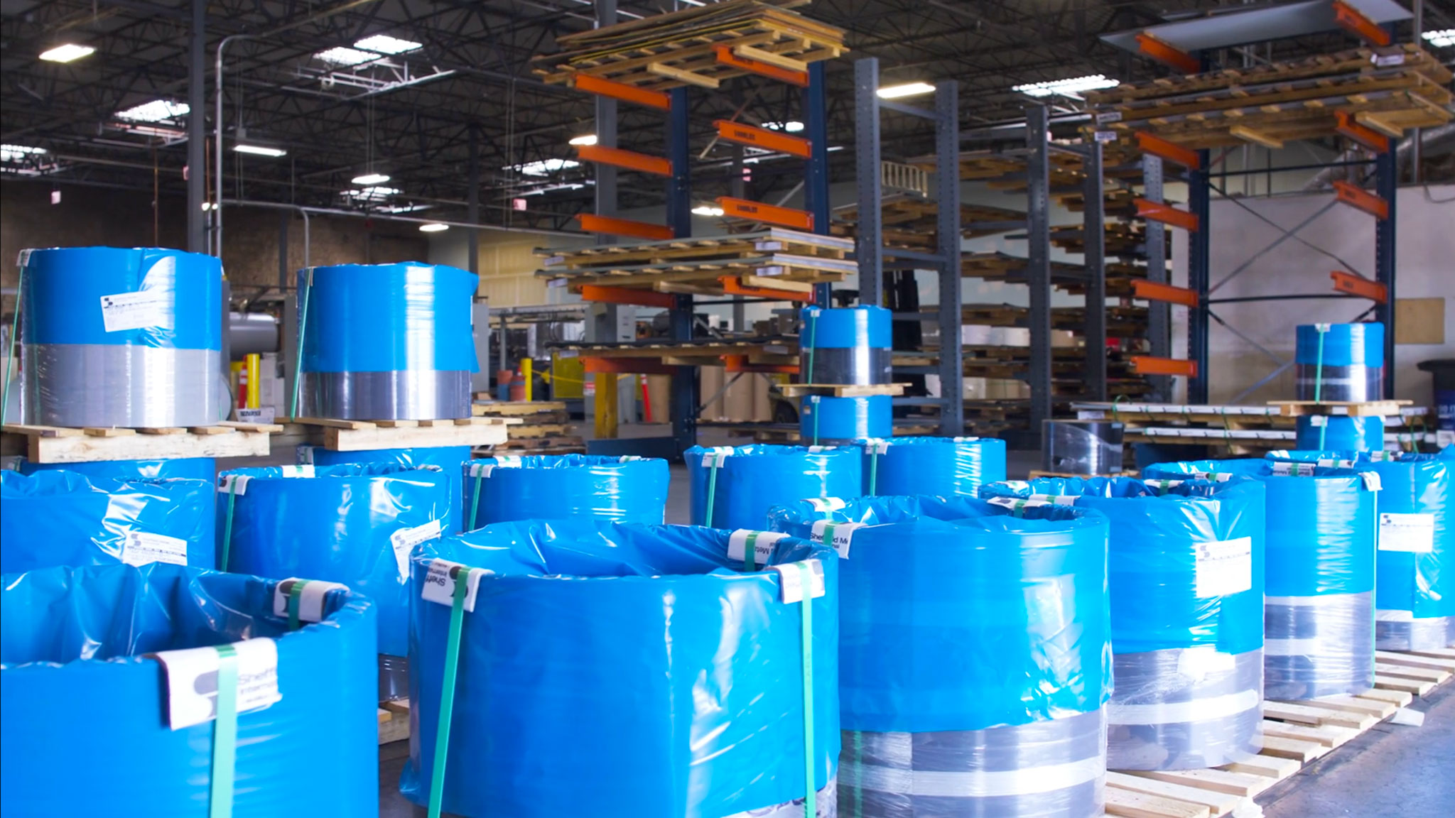 Wrapped metal coils stored at the Sheffield Metals Denver service center
