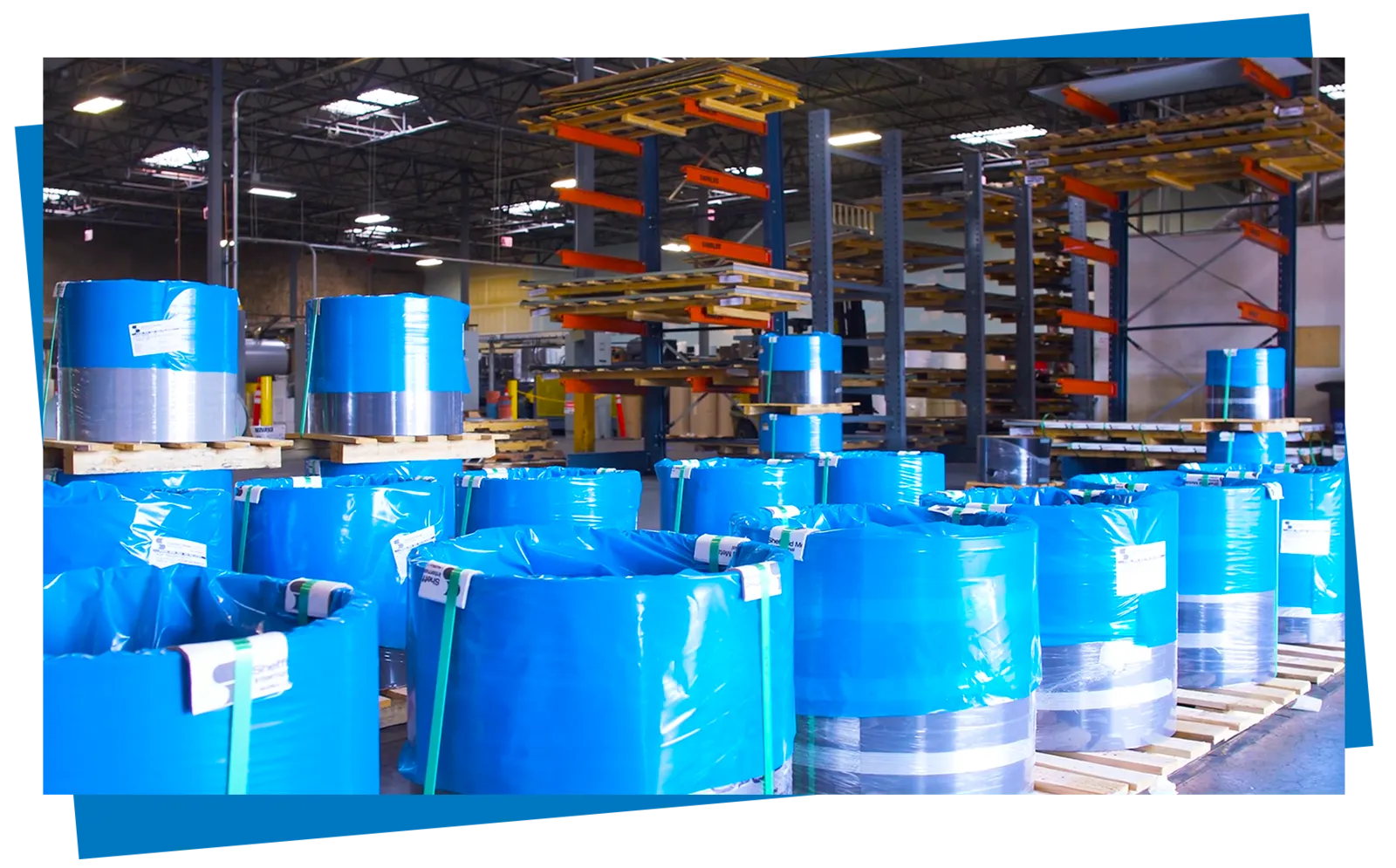 Sheffield Metals coils in blue branded packaging at a service center