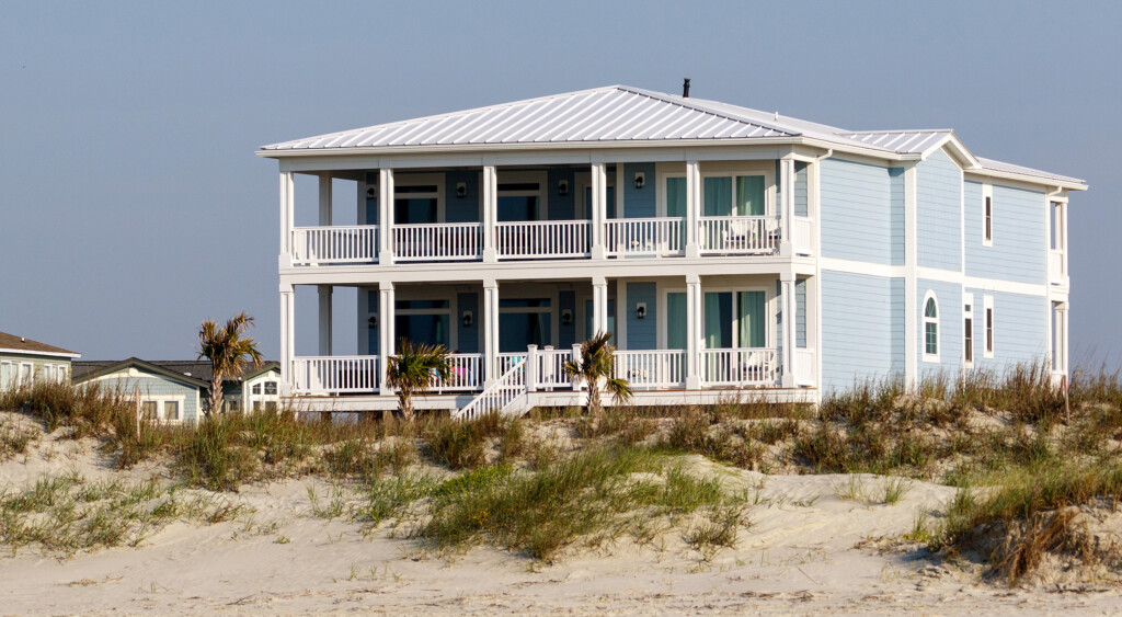 Home on the coastline that features an aluminum standing seam metal roof