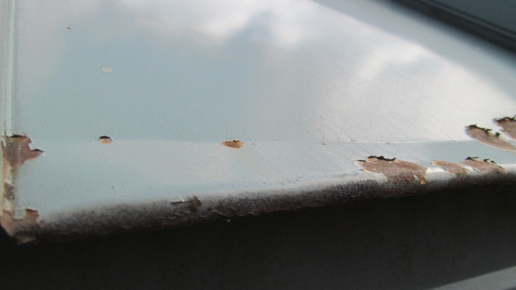 Repainting vs. Replacing Your Metal Roof: From a Restoration Pro