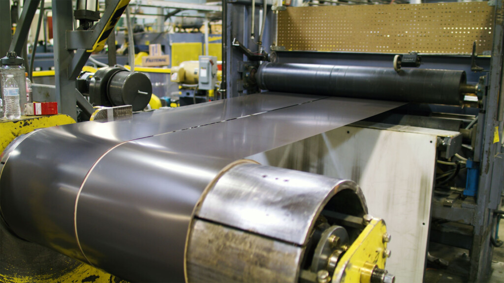 a metal coil slitting line prepares metal for roofing