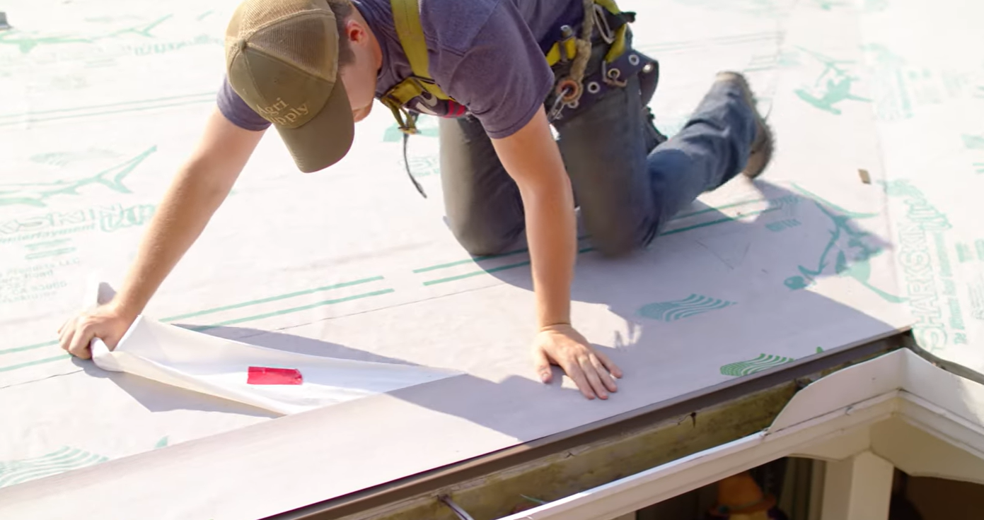 A contractor installing Sharkskin Ultra SA