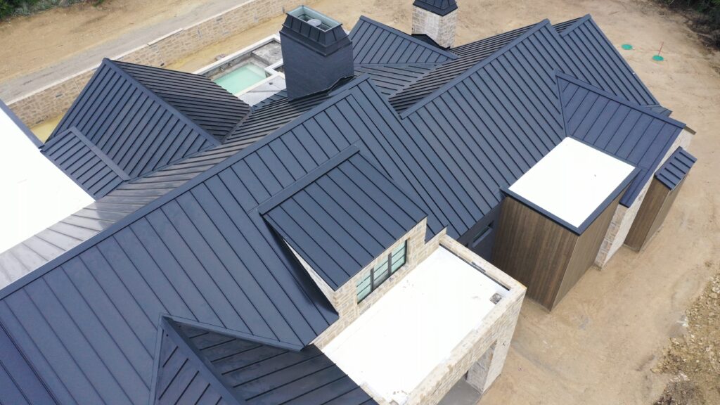 Drone footage of a matte black standing seam metal roof